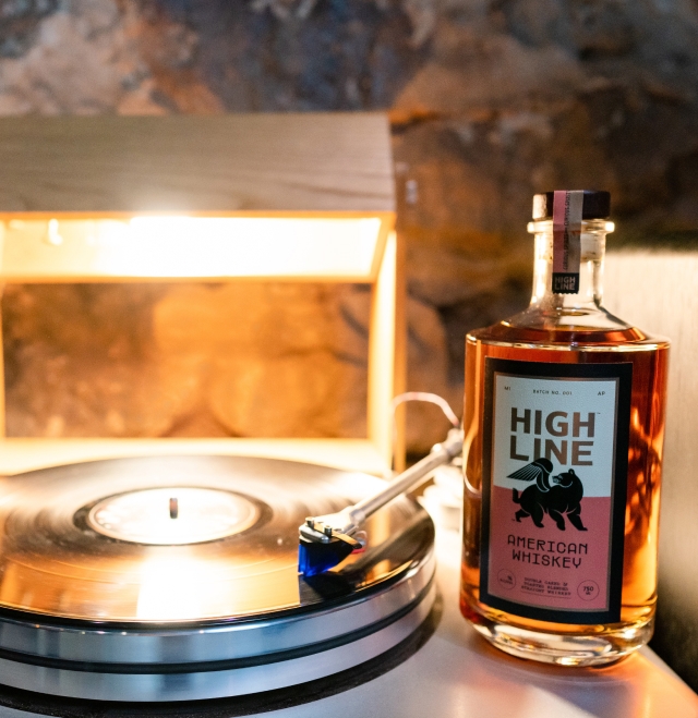 Image of Highline American Whiskey sitting on the side of a record player